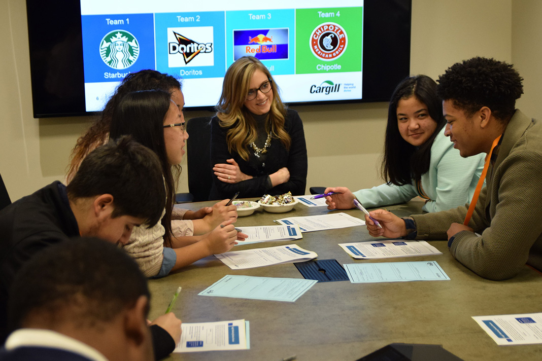 students with classroom plus instructor working around table