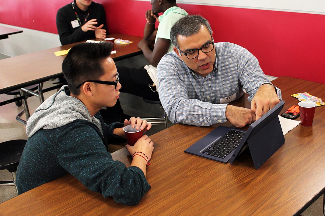 student and mentor at ipad
