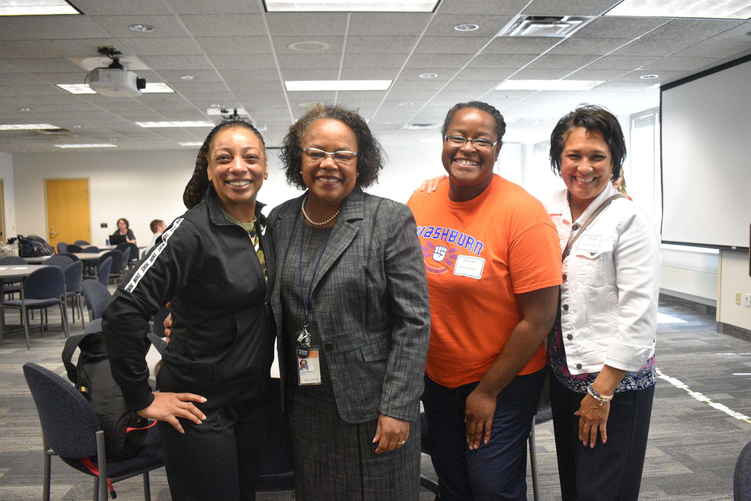 TIW - four people smiling