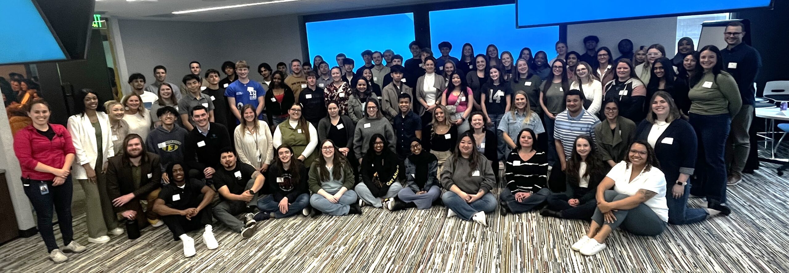 Large group photo of students and adults.
